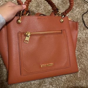 red/brown color steve madden purse